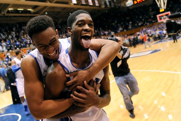 DURHAM, NC - JANUARY 13:  Jabari Parker #1 and Amile Jefferson #21 of the Duke Blue Devils celebrate as they leave the floor following a last-second win over the Virginia Cavaliers at Cameron Indoor Stadium on January 13, 2014 in Durham, North Carolina. Duke won 69-65.  (Photo by Grant Halverson/Getty Images)