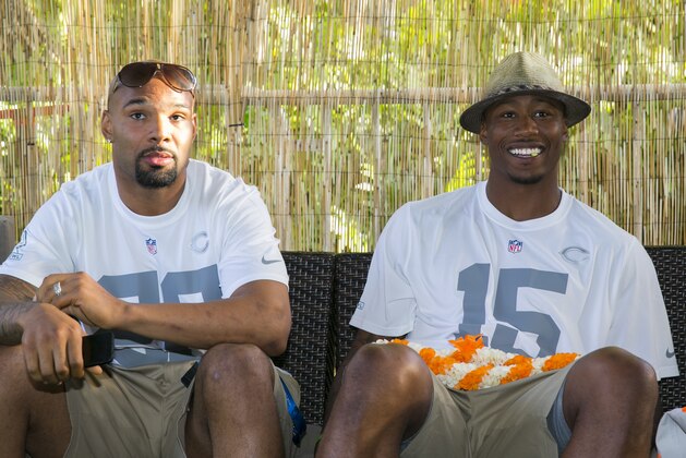 Chicago Bears running back Matt Forte (22), left, and Chicago Bears wide receiver Brandon Marshall (15) sit in the green room during the NFL Pro Bowl Draft, Wednesday, Jan. 22, 2014, Kapolei, Hawaii.  (AP Photo/Marco Garcia)