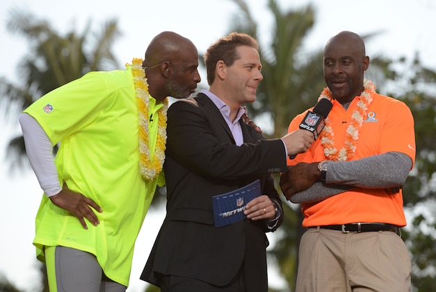 January 22, 2014; Ko'Olina, HI, USA; NFL Network reporter Chris Rose (center) interview Team Rice alumni captain Jerry Rice (right) in front of Team Sanders alumni captain Deion Sanders (left) during the Pro Bowl draft at J.W. Marriott Ihilani Resort & Spa. Mandatory Credit: Kyle Terada-USA TODAY Sports