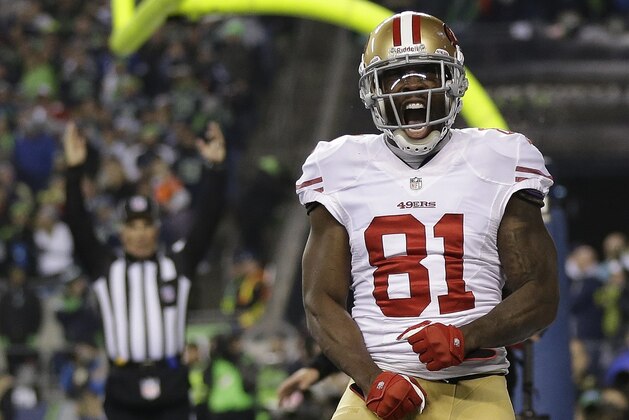 San Francisco 49ers' Anquan Boldin celebrates his touchdown catch during the second half of the NFL football NFC Championship game against the Seattle Seahawks Sunday, Jan. 19, 2014, in Seattle. (AP Photo/Marcio Jose Sanchez)