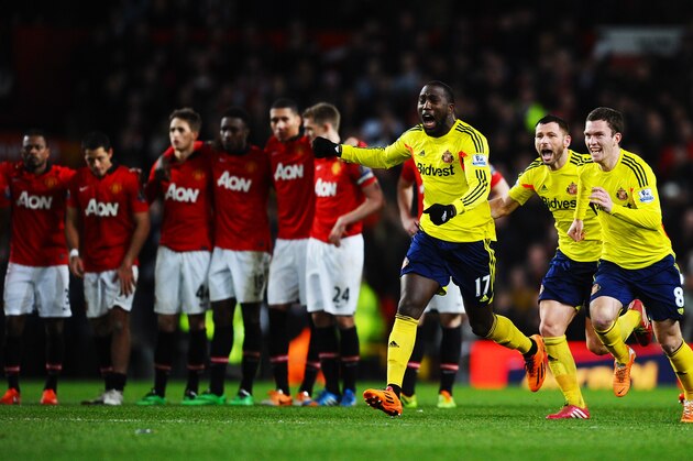 MANCHESTER, ENGLAND - JANUARY 22:  (L-R) Jozy Altidore, Phil Bardsley and Adam Johnson of Sunderland celebrate following their team's 2-1 victory in the penalty shootout during the Capital One Cup semi final, second leg match between Manchester United and Sunderland at Old Trafford on January 22, 2014 in Manchester, England.  (Photo by Laurence Griffiths/Getty Images)