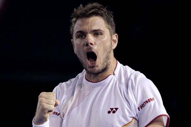 Stanislas Wawrinka of Switzerland celebrates a point won against Tomas Berdych of the Czech Republic during their semifinal at the Australian Open tennis championship in Melbourne, Australia, Thursday, Jan. 23, 2014.(AP Photo/Rick Rycroft)