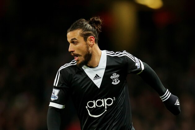 LONDON, ENGLAND - NOVEMBER 23: Daniel Osvaldo of Southampton runs with the ball during the Barclays Premier League match between Arsenal and Southampton at Emirates Stadium on November 23, 2013 in London, England.  (Photo by Clive Rose/Getty Images)