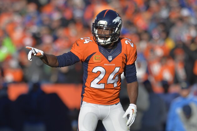 Denver Broncos cornerback Champ Bailey (24) motions to teammates against the San Diego Chargers in the first quart erof an NFL AFC division playoff football game, Sunday, Jan. 12, 2014, in Denver. (AP Photo/Jack Dempsey)