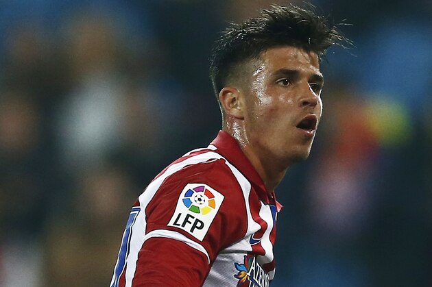 Atletico's Hector, right, celebrates Atletico's Toby Alderweireld's goal during a Copa del Rey soccer match between Atletico de Madrid and Sant Andreu at the Vicente Calderon stadium in Madrid, Spain, Wednesday, Dec. 18, 2013. (AP Photo/Andres Kudacki)