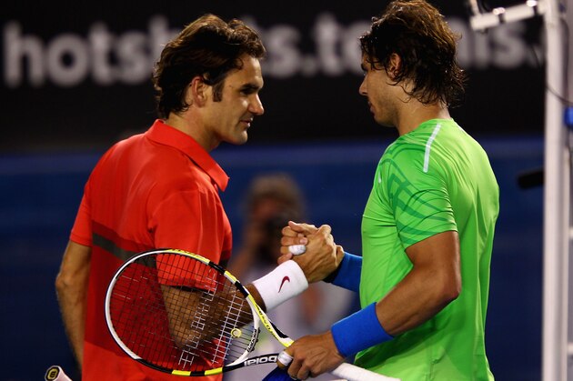 MELBOURNE, AUSTRALIA - JANUARY 26:  Roger Federer of Switzerland and Rafael Nadal of Spain embrace at the net after their semifinal match during day eleven of the 2012 Australian Open at Melbourne Park on January 26, 2012 in Melbourne, Australia.  (Photo by Clive Brunskill/Getty Images)
