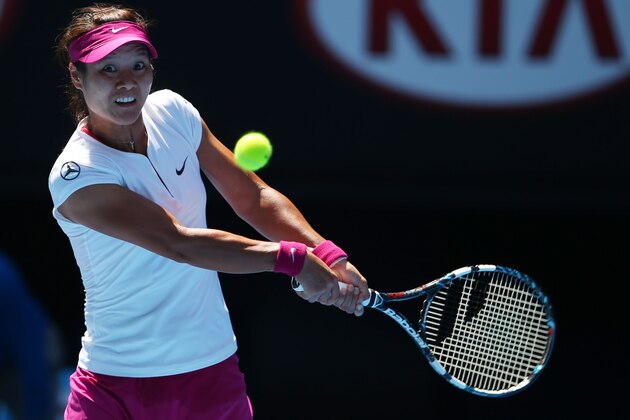 MELBOURNE, AUSTRALIA - JANUARY 23:  Na Li of China plays a backhand in her semifinal match against Eugenie Bouchard of Canada during day 11 of the 2014 Australian Open at Melbourne Park on January 23, 2014 in Melbourne, Australia.  (Photo by Mark Kolbe/Getty Images)