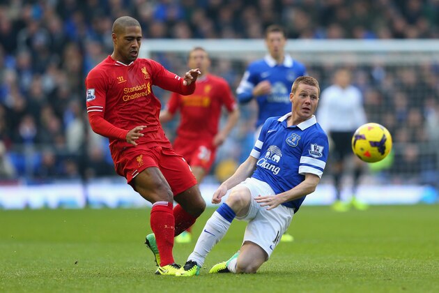 LIVERPOOL, ENGLAND - NOVEMBER 23:  James McCarthy of Everton competes with Glen Johnson of Liverpool during the Barclays Premier League match between Everton and Liverpool at Goodison Park on November 23, 2013 in Liverpool, England.  (Photo by Alex Livesey/Getty Images)