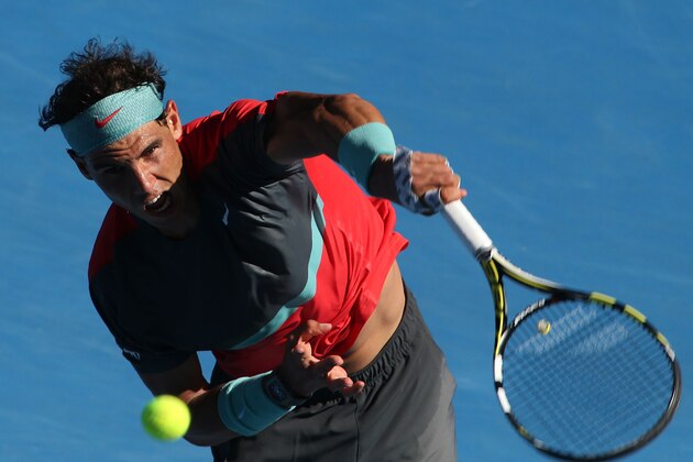 MELBOURNE, AUSTRALIA - JANUARY 22:  Rafael Nadal of Spain serves in his quarterfinal match against Grigor Dimitrov of Bulgaria during day 10 of the 2014 Australian Open at Melbourne Park on January 22, 2014 in Melbourne, Australia.  (Photo by Clive Brunskill/Getty Images)