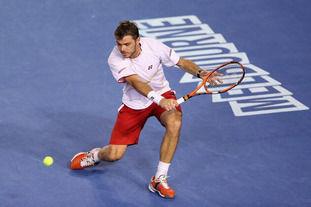 MELBOURNE, AUSTRALIA - JANUARY 23:  Stanislas Wawrinka of Switzerland plays a backhand in his semifinal match against Tomas Berdych of the Czech Republic during day 11 of the 2014 Australian Open at Melbourne Park on January 23, 2014 in Melbourne, Australia.  (Photo by Clive Brunskill/Getty Images)