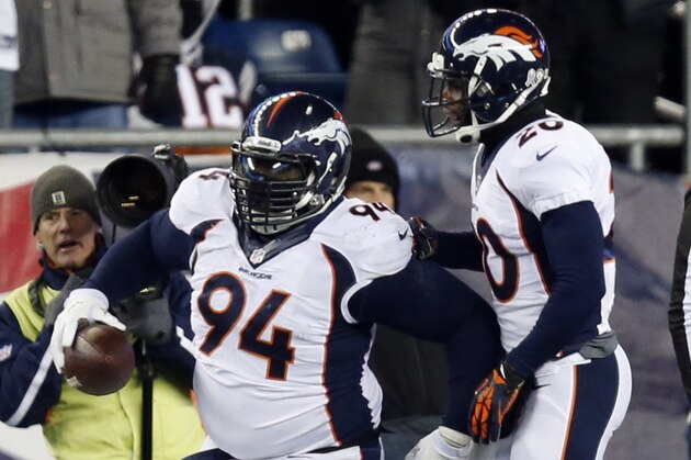 Denver Broncos defensive tackle Terrance Knighton (94) celebrates his recovery of a fumble by New England Patriots quarterback Tom Brady in the first quarter of an NFL football game Sunday, Nov. 24, 2013, in Foxborough, Mass. (AP Photo/Elise Amendola)