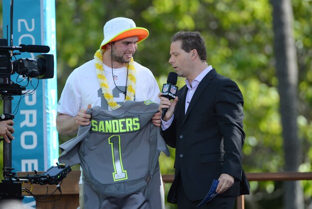 January 22, 2014; Ko'Olina, HI, USA; Indianapolis Colts quarterback Andrew Luck (left) is interviewed by Chris Rose (right) after being picked by Team Sanders during the Pro Bowl draft at J.W. Marriott Ihilani Resort & Spa. Mandatory Credit: Kyle Terada-USA TODAY Sports