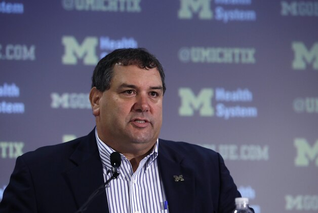 Michigan head football coach Brady Hoke addresses the media before introducing Doug Nussmeier as Michigan's offensive coordinator and quarterbacks coach in Ann Arbor, Mich., Friday, Jan. 10, 2014. (AP Photo/Carlos Osorio) Michigan head football coach Brady Hoke addresses the media before introducing Doug Nussmeier as Michigan's offensive coordinator and quarterbacks coach in Ann Arbor, Mich., Friday, Jan. 10, 2014. (AP Photo/Carlos Osorio)