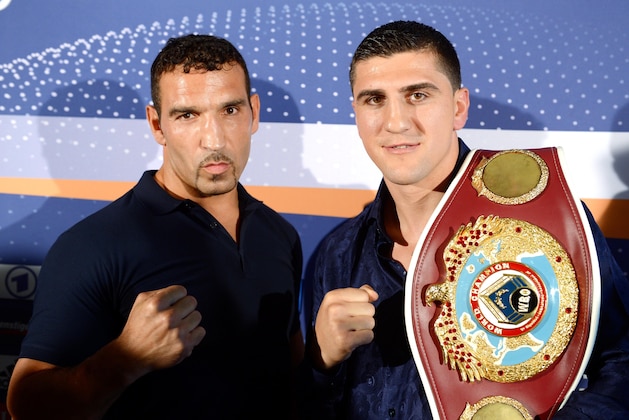 German professional boxers Firat Arslan, left, and Marco Huck  pose  during a press conference in Stuttgart, Germany, Thursday July 18, 2013.  Marco Huck will  try to defend his WBO world cruiserweight championship title  against Firat Arslan on Sept. 14, 2013. in Stuttgart (AP Photo/dpa, Bernd Weissbrod)