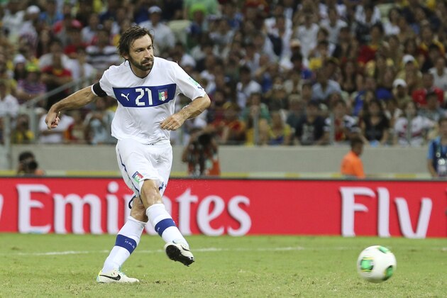 Italy's Andrea Pirlo scores from the spot during the penalty shoot-out of the soccer Confederations Cup semifinal match between Spain and Italy at Castelao stadium in Fortaleza, Brazil, Thursday, June 27, 2013. Italy lost and advanced to the third place match in Salvador. (AP Photo/Antonio Calanni)