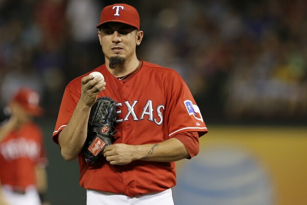 Texas Rangers starting pitcher Matt Garza (22) looks down as he works against the Minnesota Twins in the fourth inning of a baseball game, Saturday, Aug. 31, 2013, in Arlington, Texas. (AP Photo/Tony Gutierrez) Texas Rangers starting pitcher Matt Garza (22) looks down as he works against the Minnesota Twins in the fourth inning of a baseball game, Saturday, Aug. 31, 2013, in Arlington, Texas. (AP Photo/Tony Gutierrez)