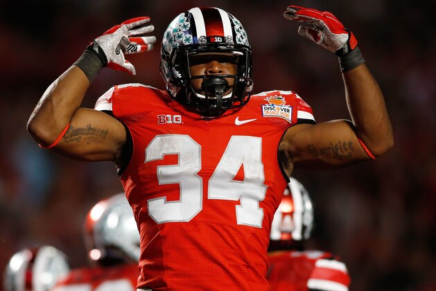 Jan 3, 2014; Miami Gardens, FL, USA; Ohio State Buckeyes running back Carlos Hyde (34) reacts against the Clemson Tigers in the second half of the 2014 Orange Bowl college football game at Sun Life Stadium. Mandatory Credit: Robert Mayer-USA TODAY Sports