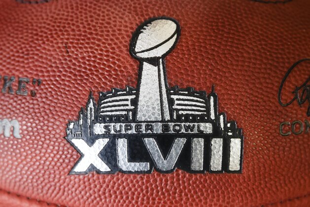 Official game ball for the NFL football Super Bowl XLVIII in the Wilson Sporting Goods Co. in Ada, Ohio, Monday, Jan. 20, 2014. The Seattle Seahawks will play the Denver Broncos in the Super Bowl on Feb. 2 in New Jersey. (AP Photo/Rick Osentoski)