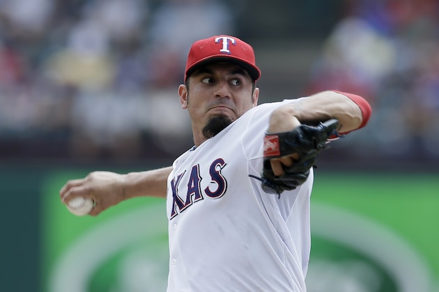 Texas Rangers starting pitcher Matt Garza (22) works against the Pittsburgh Pirates during a baseball game, Wednesday, Sept. 11, 2013, in Arlington, Texas. The Pirates won 7-5. (AP Photo/Tony Gutierrez)