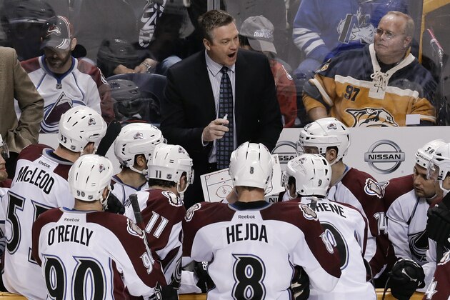 Colorado Avalanche coach Patrick Roy talks with his players during a timeout in the third period of an NHL hockey game against the Nashville Predators on Saturday, Jan. 18, 2014, in Nashville, Tenn. The Avalanche won 5-4. (AP Photo/Mark Humphrey)