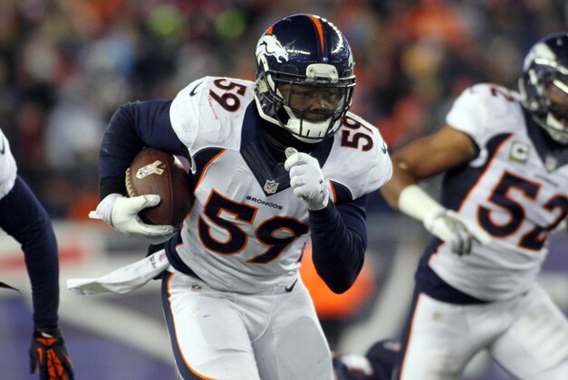 Nov 24, 2013; Foxborough, MA, USA;  Denver Broncos outside linebacker Danny Trevathan (59) returns a recovered fumble during the first quarter against the New England Patriots at Gillette Stadium. Mandatory Credit: Stew Milne-USA TODAY Sports