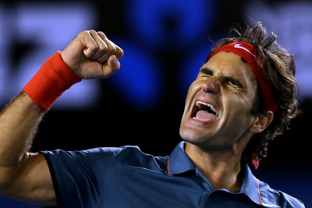 Roger Federer of Switzerland celebrates after defeating Andy Murray of Britain during their quarterfinal at the Australian Open tennis championship in Melbourne, Australia, Wednesday, Jan. 22, 2014.(AP Photo/Aaron Favila)