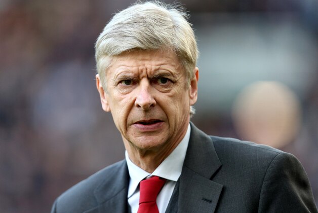 Arsenal's manager Arsene Wenger looks on ahead of their English Premier League soccer match against Newcastle United at St James' Park, Newcastle, England, Sunday, Dec. 29, 2013. (AP Photo/Scott Heppell) Arsenal's manager Arsene Wenger looks on ahead of their English Premier League soccer match against Newcastle United at St James' Park, Newcastle, England, Sunday, Dec. 29, 2013. (AP Photo/Scott Heppell)