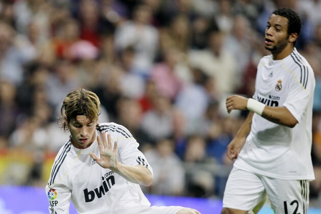Real Madrid's Sergio Ramos, left, reacts next to Marcelo of Brazil during a Spanish La Liga soccer match against Getafe at the Santiago Bernabeu stadium in Madrid, Saturday Oct. 31, 2009.  (AP Photo/Paul White)