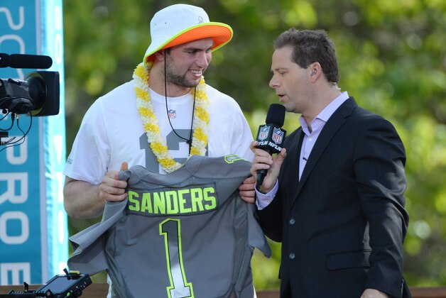 January 22, 2014; Ko'Olina, HI, USA; Indianapolis Colts quarterback Andrew Luck (left) is interviewed by Chris Rose (right) after being picked by Team Sanders during the Pro Bowl draft at J.W. Marriott Ihilani Resort & Spa. Mandatory Credit: Kyle Terada-USA TODAY Sports