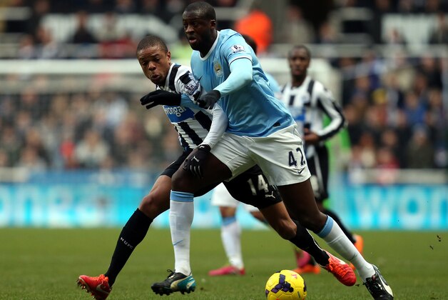 Newcastle United's Loic Remy, left, puts pressure on Manchester City's Yaya Toure, right, during their English Premier League soccer match at St James' Park, Newcastle, England, Sunday, Jan. 12, 2014. (AP Photo/Scott Heppell) Newcastle United's Loic Remy, left, puts pressure on Manchester City's Yaya Toure, right, during their English Premier League soccer match at St James' Park, Newcastle, England, Sunday, Jan. 12, 2014. (AP Photo/Scott Heppell)
