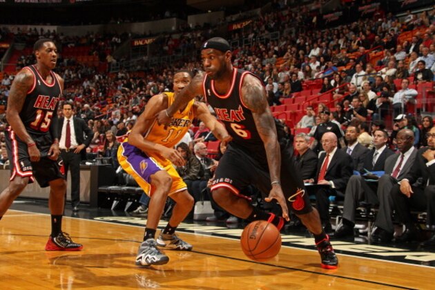 MIAMI, FL - JANUARY 23:   LeBron James #6 of the Miami Heat drives to the basket against the Los Angeles Lakers at the American Airlines Arena in Miami, Florida on Jan. 23, 2014. NOTE TO USER: User expressly acknowledges and agrees that, by downloading and/or using this photograph, user is consenting to the terms and conditions of the Getty Images License Agreement. Mandatory copyright notice: Copyright NBAE 2014 (Photo by Issac Baldizon/NBAE via Getty Images)