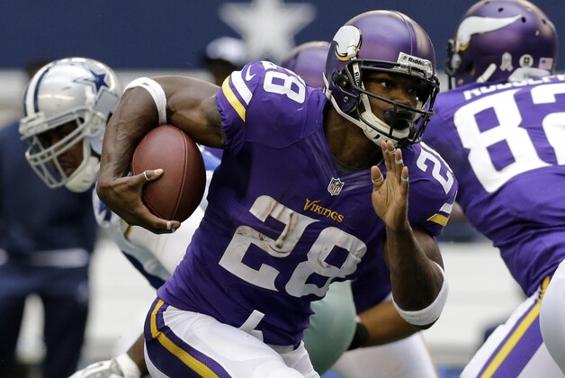 Minnesota Vikings running back Adrian Peterson (28) finds running room from the line of scrimmage during the first half of an NFL football game against the Dallas Cowboys, Sunday, Nov. 3, 2013, in Arlington, Texas. (AP Photo/Nam Y. Huh)