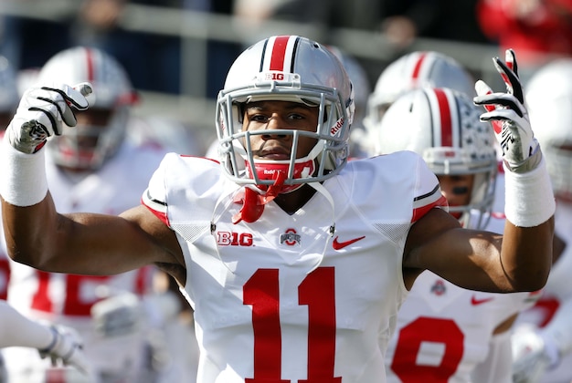Nov 2, 2013; West Lafayette, IN, USA; Ohio State Buckeyes safety Vonn Bell (11) reacts as he runs onto the field before the game against the Purdue Boilermakers at Ross Ade Stadium. Mandatory Credit: Brian Spurlock-USA TODAY Sports