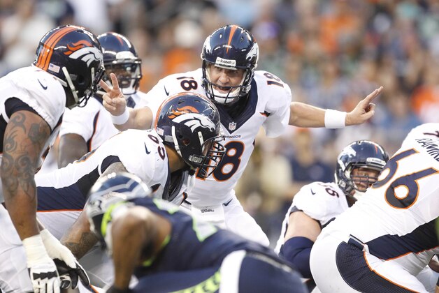 Aug 17, 2013; Seattle, WA, USA; Denver Broncos quarterback Peyton Manning (18) calls an audible against the Seattle Seahawks during the second quarter at CenturyLink Field. Mandatory Credit: Joe Nicholson-USA TODAY Sports