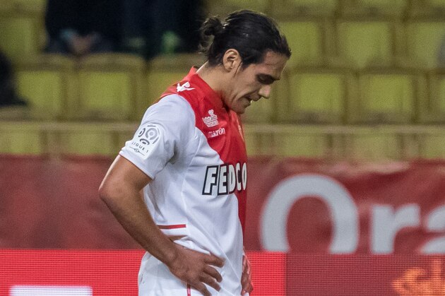 MONTE-CARLO, MONACO - DECEMBER 20:  Monaco's foward Radamel Falcao (R) misses his penalty on Valenciennes's defender Saliou Ciss (L)  during the French L1 football match between AS Monaco vs Valenciennes at Louis II Stadium on December 20, 2013 in Monte-Carlo, Monaco.  (Photo by Didier Baverel/Getty Images)