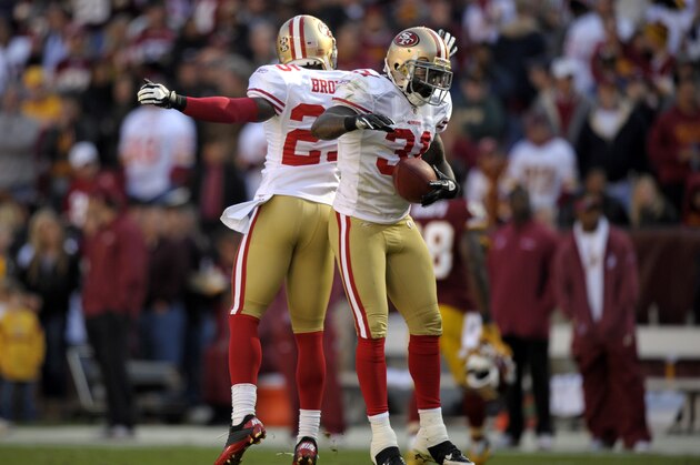 San Francisco 49ers strong safety Donte Whitner, right, celebrates with teammate Tarell Brown after recovering a fumble in the first half of an NFL football game against the Washington Redskins in Landover, Md., Sunday, Nov. 6, 2011. (AP Photo/Cliff Owen)