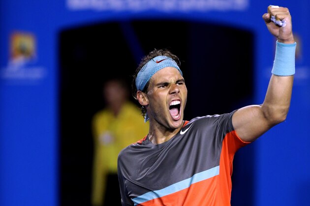 Rafael Nadal of Spain celebrates after defeating Roger Federer of Switzerland during their semifinal at the Australian Open tennis championship in Melbourne, Australia, Friday, Jan. 24, 2014.(AP Photo/Aaron Favila)