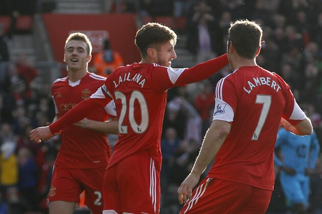 Southampton's Adam Lallana, center, celebrates his goal against Tottenham Hotspur with teammates during their English Premier League soccer match at St Mary's stadium, Southampton, England, Sunday, Dec. 22, 2013. (AP Photo/Sang Tan)