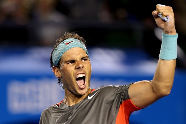MELBOURNE, AUSTRALIA - JANUARY 24:  Rafael Nadal of Spain celebrates winning his semifinal match against Roger Federer of Switzerland during day 12 of the 2014 Australian Open at Melbourne Park on January 24, 2014 in Melbourne, Australia.  (Photo by Clive Brunskill/Getty Images)