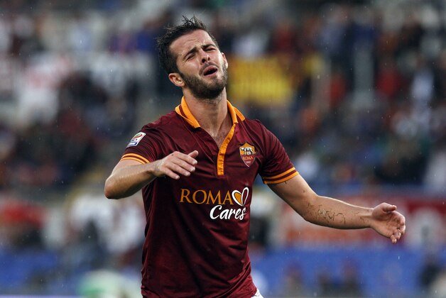 AS Roma midfielder Miralem Pjanic, of Bosnia, reacts after missing a scoring chance during a Serie A soccer match between AS Roma and Sassuolo at Rome's Olympic stadium, Sunday, Nov. 10, 2013. (AP Photo/Riccardo De Luca)