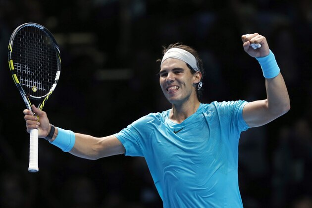 Rafael Nadal of Spain celebrates after winning the ATP World Tour Finals singles tennis match against Stanislas Wawrinka of Switzerland at the O2 Arena in London Wednesday, Nov. 6, 2013. (AP Photo/Sang Tan)