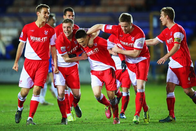 PETERBOROUGH, ENGLAND - JANUARY 14: Joe Lolley of Kidderminster Harriers (C) is congratulated by team mates as he scores their thrid goal during the FA Cup with Budweiser Third round replay match between Peterborough United and Kidderminster Harriers at London Road Stadium on January 14, 2014 in Peterborough, England. (Photo by Julian Finney/Getty Images) PETERBOROUGH, ENGLAND - JANUARY 14: Joe Lolley of Kidderminster Harriers (C) is congratulated by team mates as he scores their thrid goal during the FA Cup with Budweiser Third round replay match between Peterborough United and Kidderminster Harriers at London Road Stadium on January 14, 2014 in Peterborough, England. (Photo by Julian Finney/Getty Images)