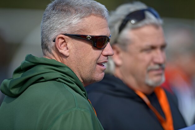 New York Jets head coach Rex Ryan, left,  watches the action from the sidelines with his brother Rob Ryan, right, defensive coordinator of the New Orleans Saints during Senior Bowl practice at Fairhope Municipal Stadium, Monday, Jan. 20, 2014 in Fairhope, Ala.  (AP Photo/G.M. Andrews)