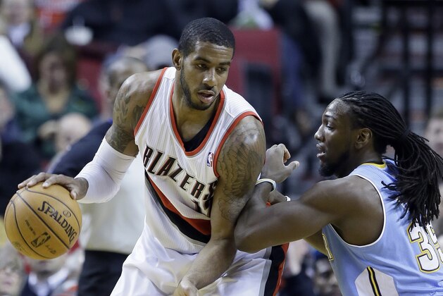 Portland Trail Blazers forward LaMarcus Aldridge, left, works the ball against Denver Nuggets forward Kenneth Faried during the first half of an NBA basketball game in Portland, Ore., Thursday, Jan. 23, 2014. (AP Photo/Don Ryan) Portland Trail Blazers forward LaMarcus Aldridge, left, works the ball against Denver Nuggets forward Kenneth Faried during the first half of an NBA basketball game in Portland, Ore., Thursday, Jan. 23, 2014. (AP Photo/Don Ryan)