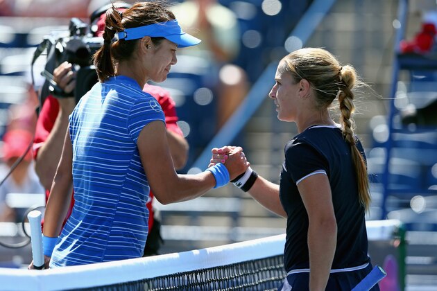 TORONTO, ON - AUGUST 09:  Na Li of China greets Dominika Cibulkova of Solvakia after winning 7-6 (1), 6-2  at the Rogers Cup Toronto on day 5 at Rexall Centre at York University on August 9, 2013 in Toronto, Canada.  (Photo by Andy Lyons/Getty Images)