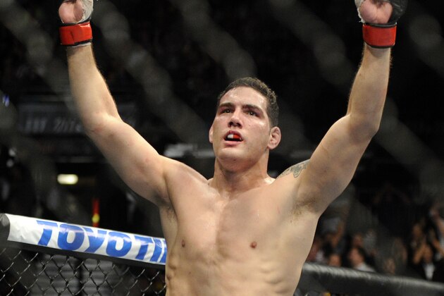 Chris Weidman of Baldwin, N.Y., celebrates after defeating Anderson Silva, of Brazil, during the UFC 168 mixed martial arts middleweight championship bout on Saturday, Dec. 28, 2013, in Las Vegas. Weidman won during the second round. (AP Photo/David Becker)