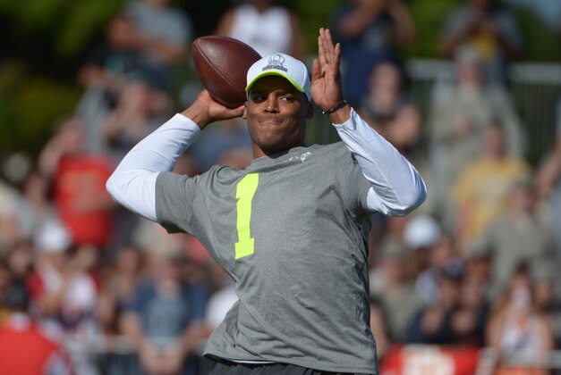 Jan 23, 2014; Honolulu, HI, USA; Carolina Panthers quarterback Cam Newton (1) throws a pass at practice for the 2014 Pro Bowl at Joint Base Pearl Harbor-Hickam. Mandatory Credit: Kirby Lee-USA TODAY Sports