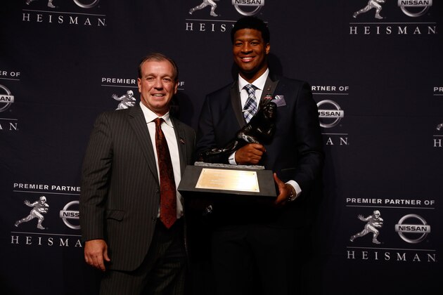 NEW YORK, NY - DECEMBER 14:  Jameis Winston, quarterback of the Florida State Seminoles, poses with Head coach Jimbo Fisher and the trophy during a press conference after the 2013 Heisman Trophy Presentation at the Marriott Marquis on December 14, 2013 in New York City.  (Photo by Jeff Zelevansky/Getty Images)