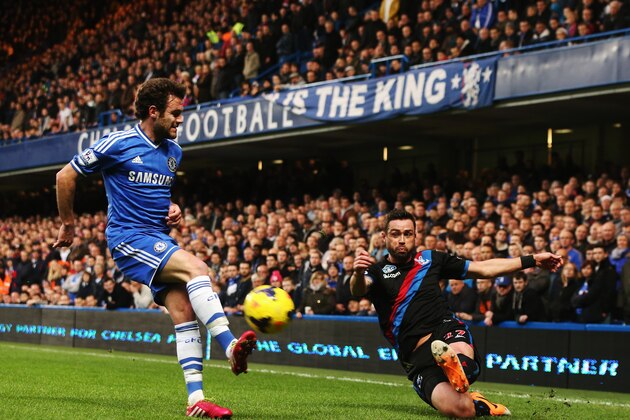 LONDON, ENGLAND - DECEMBER 14:  (L-R) Juan Mata of Chelsea and Stuart OÂKeefe of Crystal Palace challenge for the ball during the Barclays Premier League match between Chelsea and Crystal Palace at Stamford Bridge on December 14, 2013 in London, England.  (Photo by Scott Heavey/Getty Images)