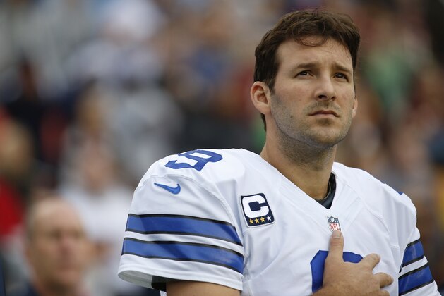 Dallas Cowboys quarterback Tony Romo stands on the sidelines during the National Anthem before an NFL football game against the Washington Redskins in Landover, Md., Sunday, Dec. 22, 2013. (AP Photo/Alex Brandon)